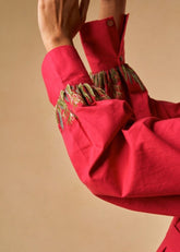 A Model Wearing Red Organic Cotton Coral Sunset organic cotton shirt, curated by Only Ethikal